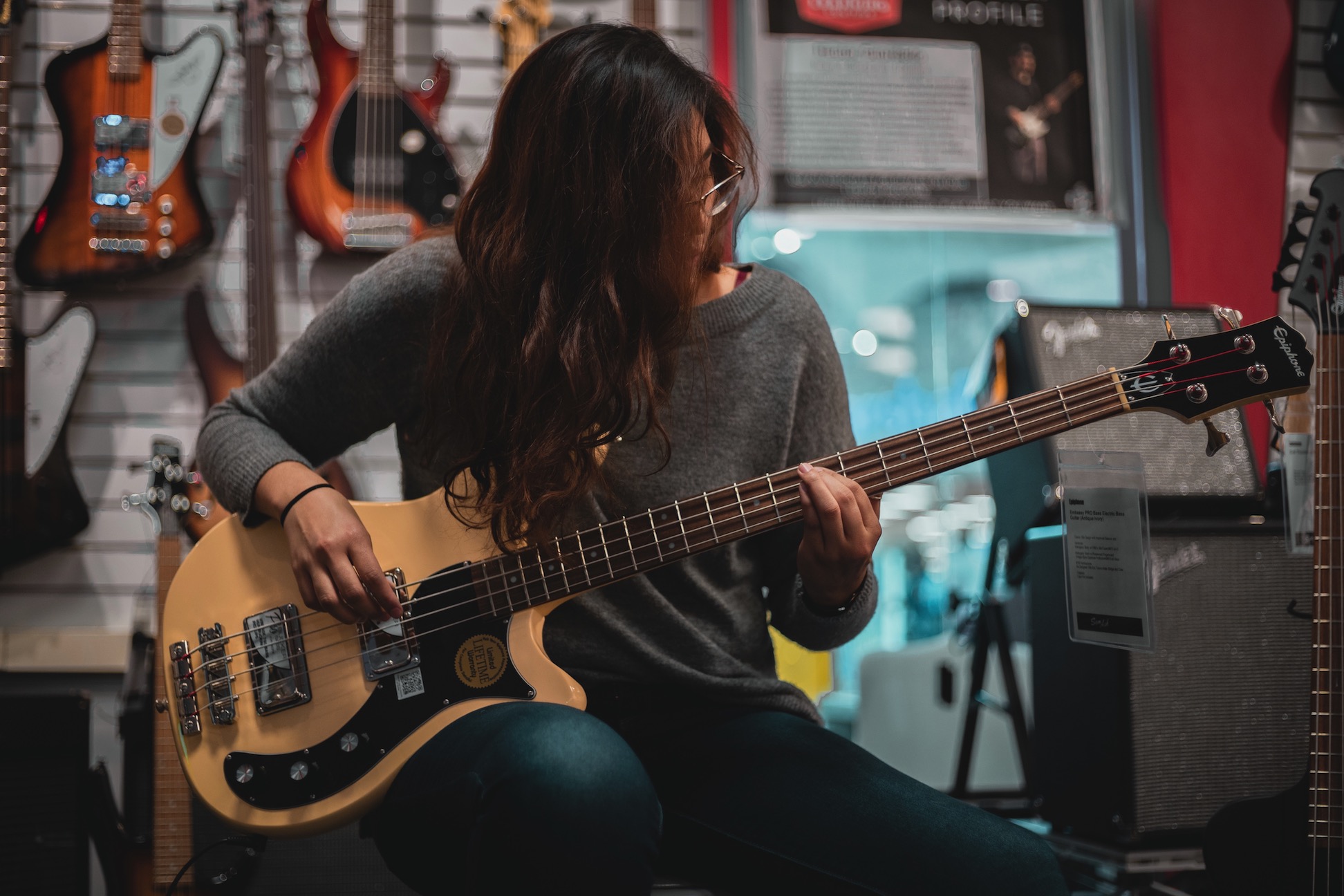 Woman plays bass guitar at Modern Music Studio in Barrie Ontario